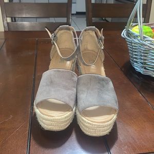 A pair of wedges brown and tan size 9